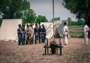 Military muster by the river.