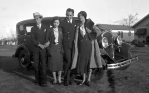 Great aunt & uncle with great grandmother in front of car